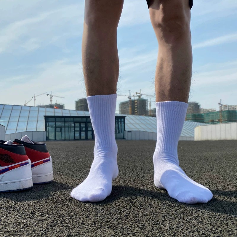 White cotton sports socks worn for basketball and everyday training
